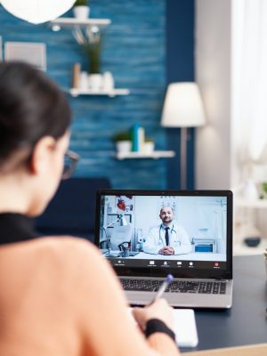 Student having online videcall conference with physician doctor